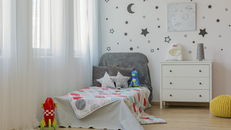 gray headboard in space room