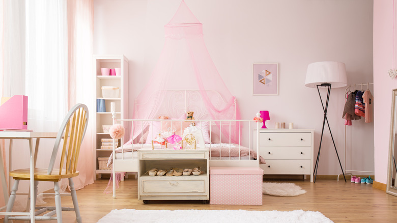 sheer pink canopy over bed