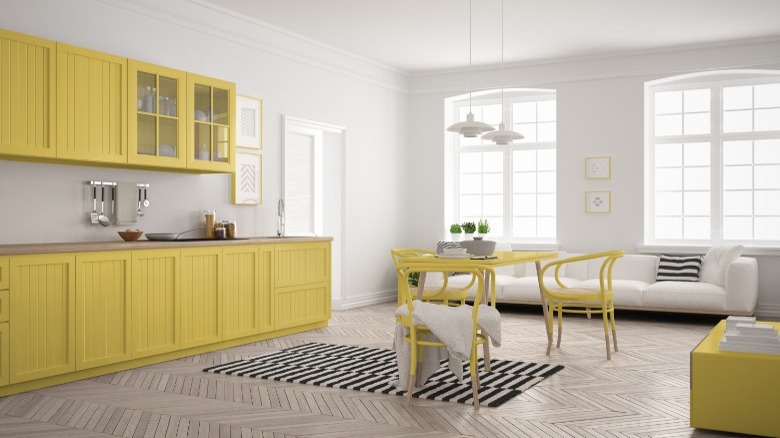 custard yellow and white kitchen