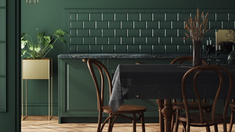 Dark green kitchen dining area