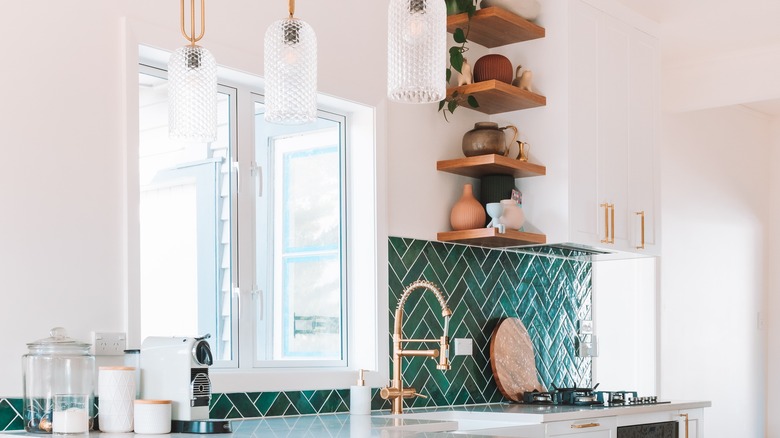 Green chevron backsplash gold hardware