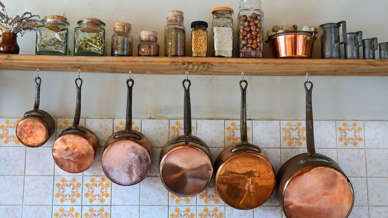 Copper pots hanging in kitchen