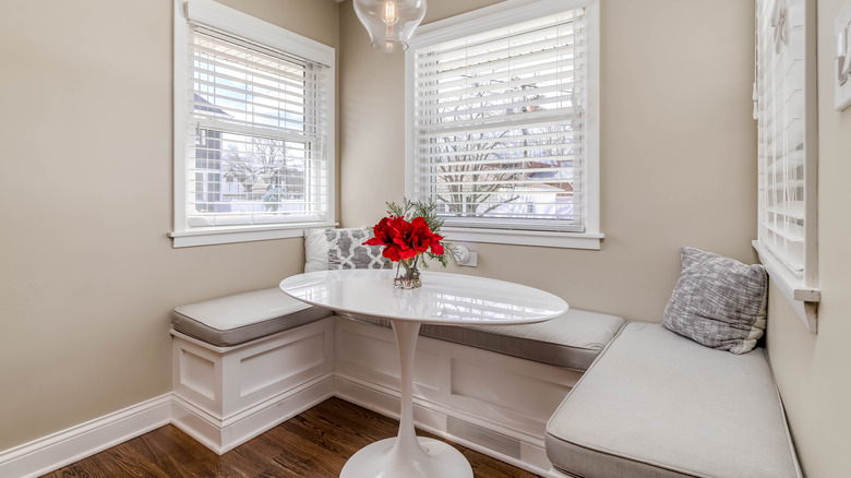 an oval table and benches