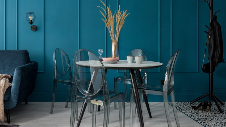plastic chairs with blue wall