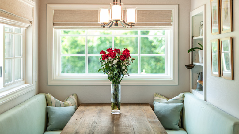 wooden table and green benches