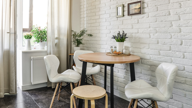 breakfast nook with white brick