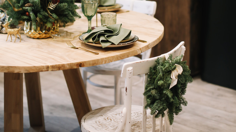 green wreath on white chair