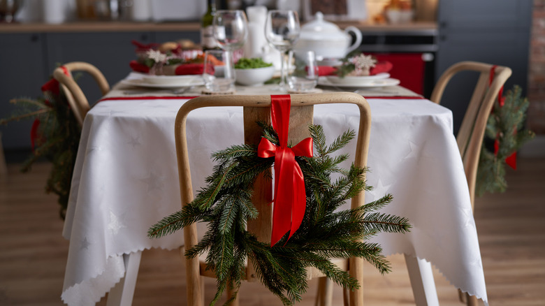 red ribbon on chair wreath