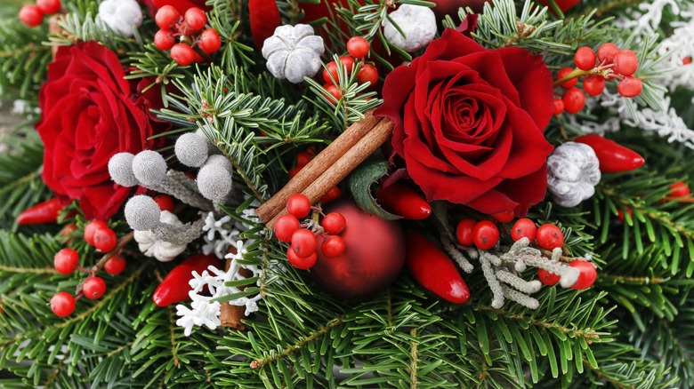 red roses in pine garland