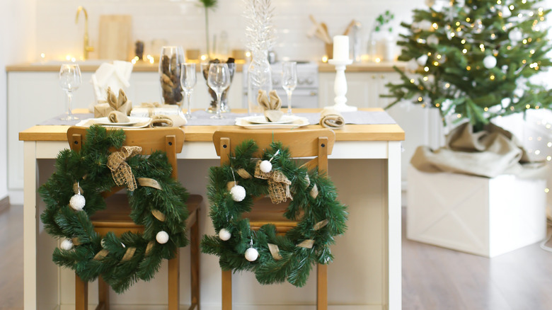 wreaths with ornaments on chairs