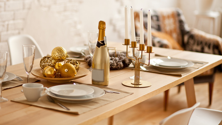 golden ornaments in wooden bowl