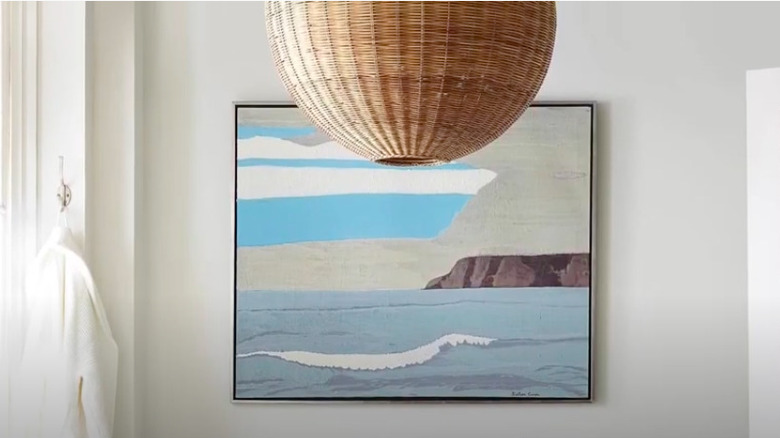 Framed ocean art in bathroom