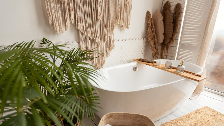 Boho style bathroom with tub