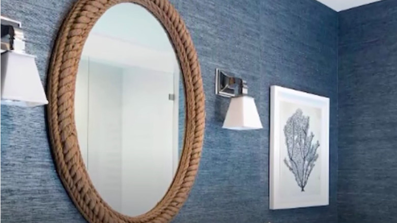 Rope mirror in blue bathroom