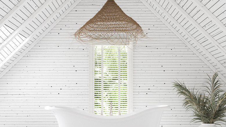 All white bathroom with bathtub