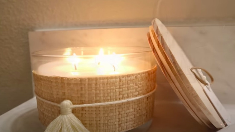 A lit tan candle 