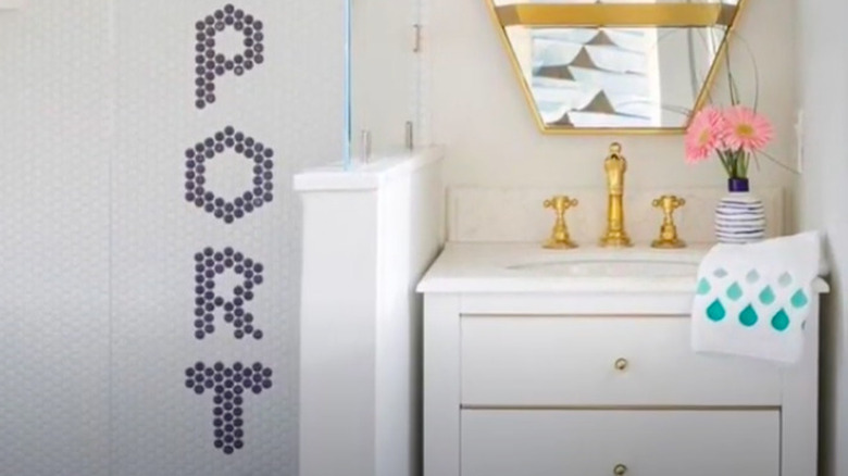 Gold, white and blue bathroom