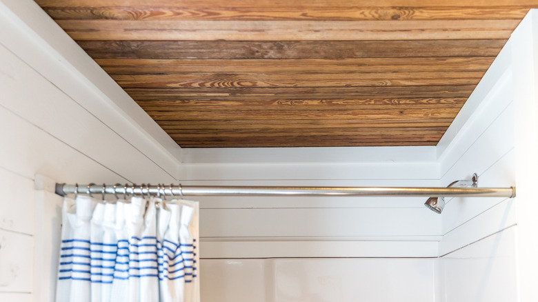 Wood ceiling above bathroom shower