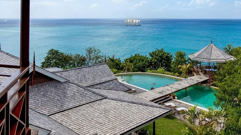 home with bridge over pool