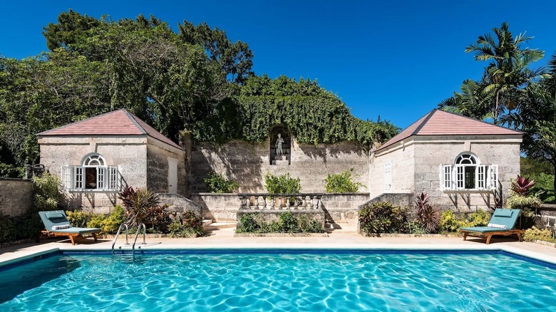 pool with stone building