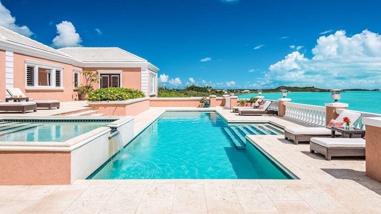 pink villa with a pool