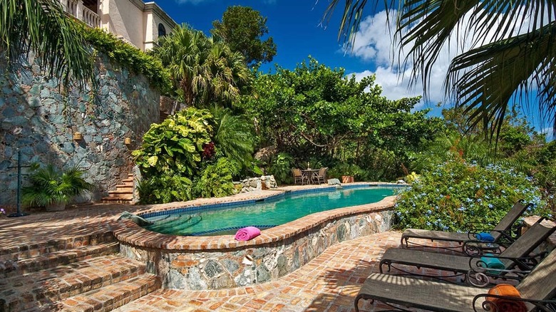 pool by a stone wall