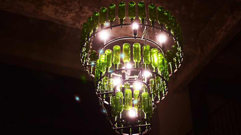 Beer bottle chandelier hanging in a bar