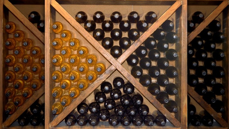 Whiskey bottles stored in DIY rack