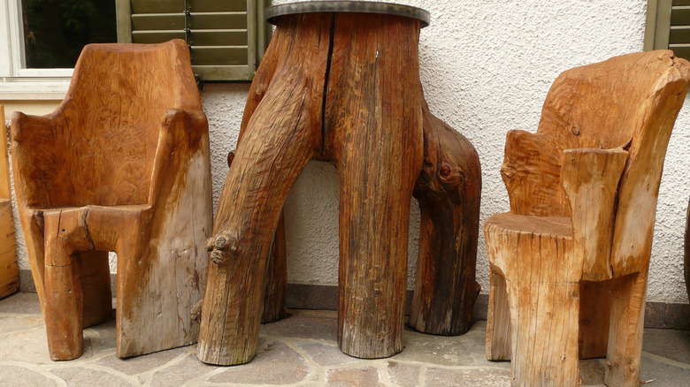 Chairs and table carved from tree trunks