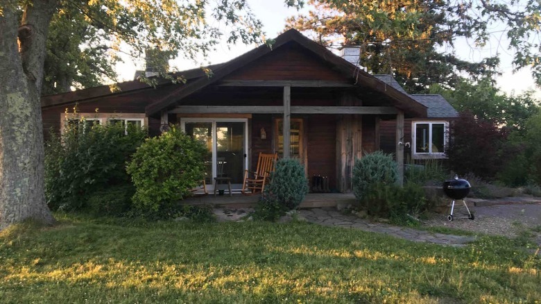 brown home by tree