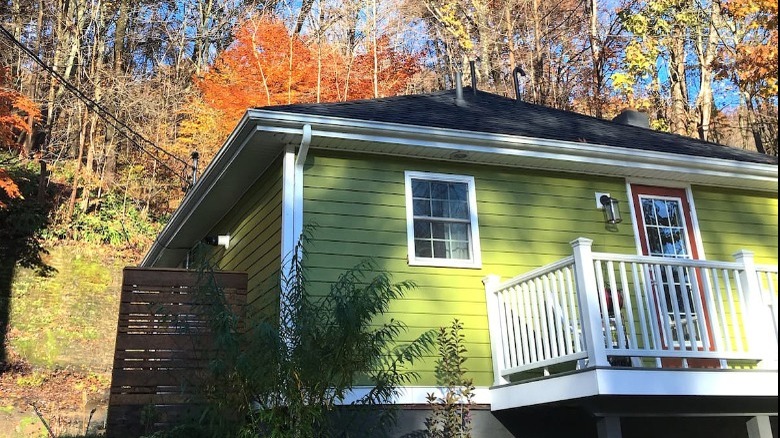 green cottage in autumn