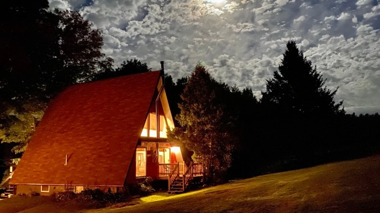 A-frame house at night