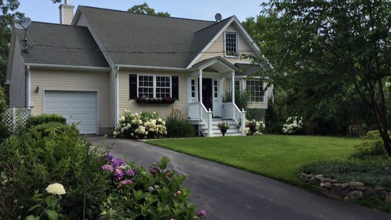 house with flowerbeds