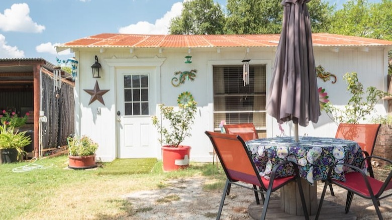 Backyard view of cute house