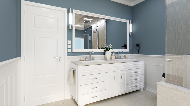 Blue and white bathroom with double sink