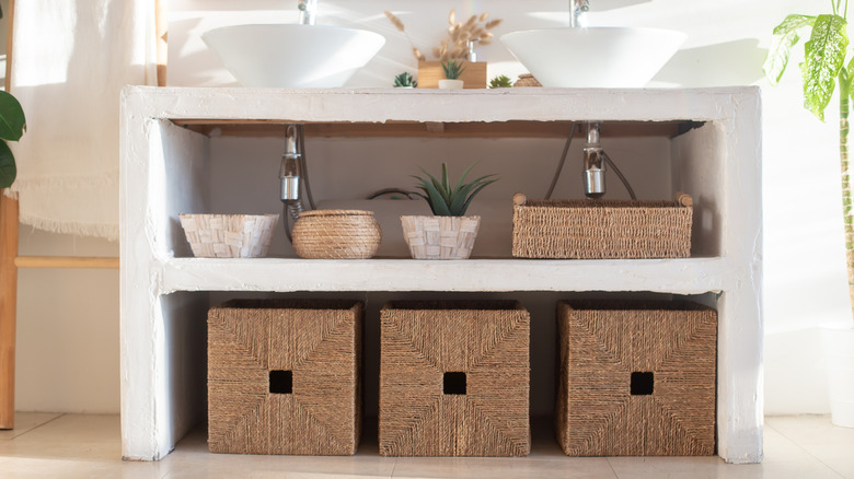 Baskets under open bathroom vanity