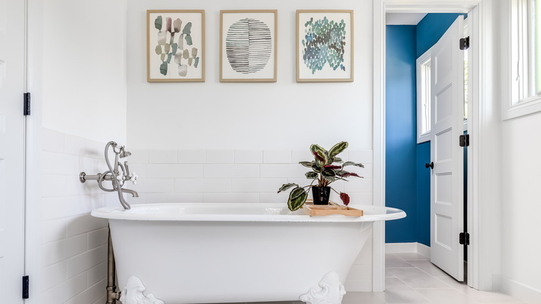 Art frames above bathtub