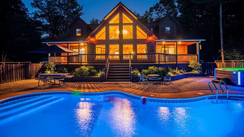 chalet and pool at night