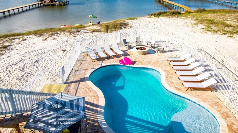 pool by a sandy beach