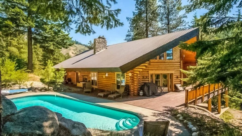 log cabin by pool