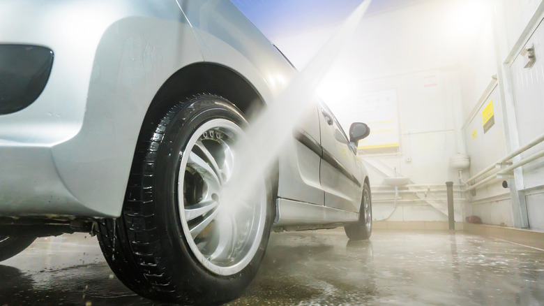 Pressure-washing car tire