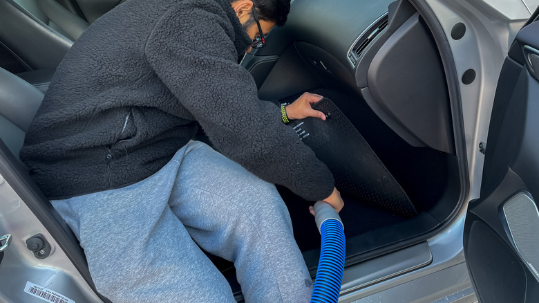 Man using carpet extractor