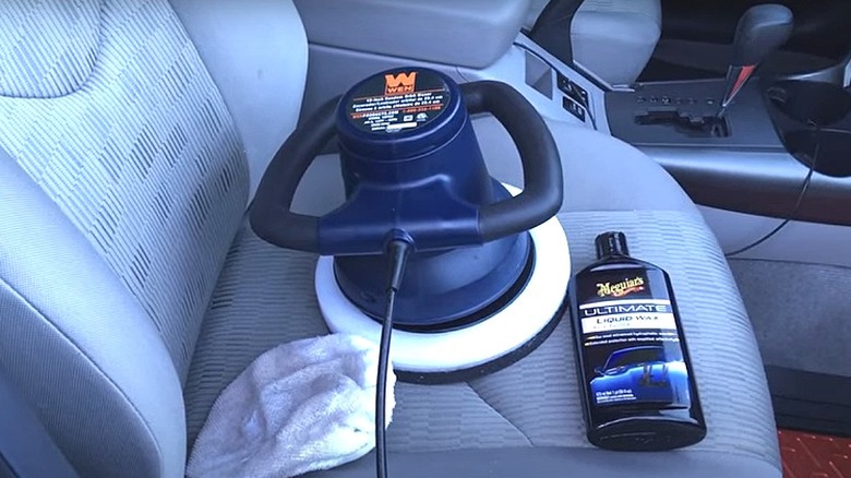 Wax, buffer, and towel on car seat