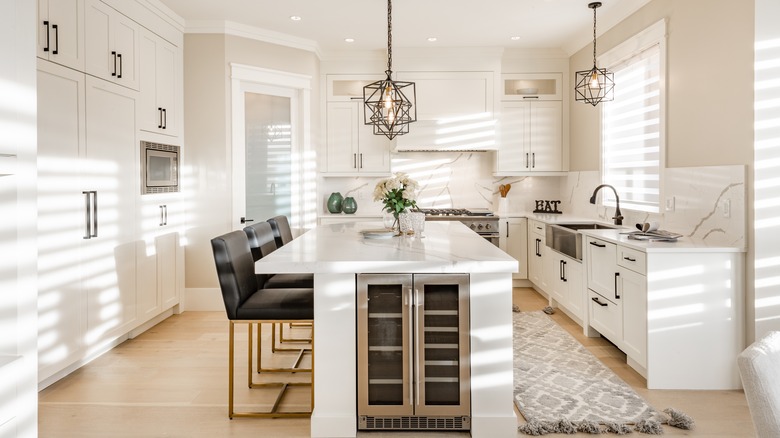 White kitchen layout with island