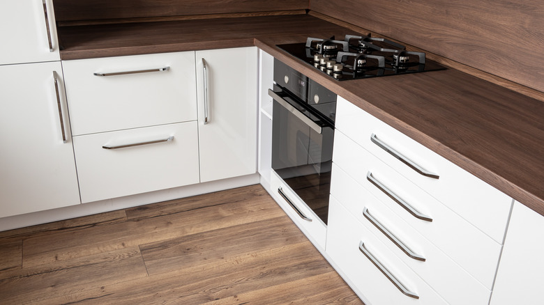 Brown and white L-shaped kitchen