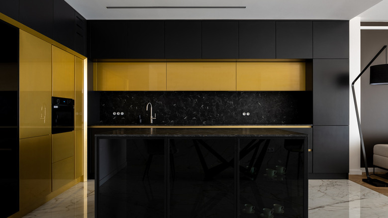 yellow kitchen with black backsplash