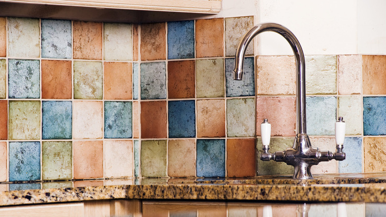 aged stone tile backsplash