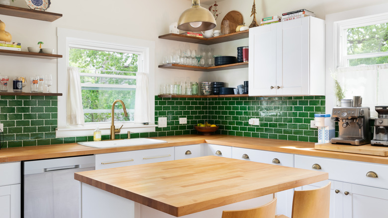 kitchen with forest green backsplash