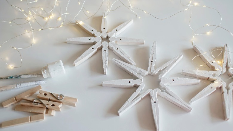 White clothespin snowflakes and lights