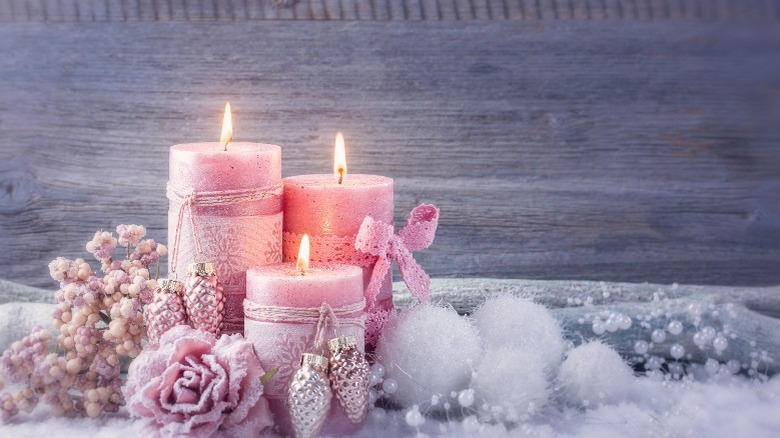 Lit pink candles and ornaments